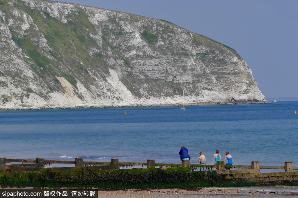 英國多塞特海邊落日 日光昏黃寧靜絕美