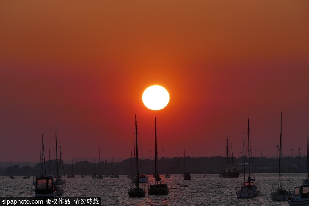 英國多塞特海邊落日 日光昏黃寧靜絕美